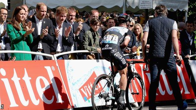 The Duke and Duchess of Cambridge and Prince Harry applaud Cavendish as he rides over the finish line