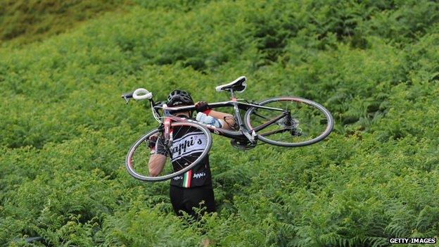 Spectator wading through bracken at Holme Moss