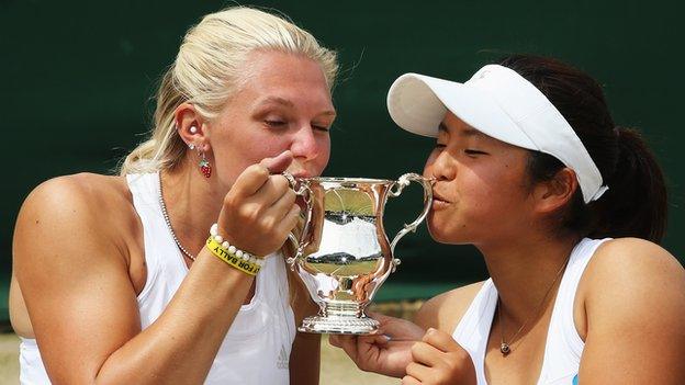 Britain's Jordanne Whiley and partner Yui Kamiji with Wimbledon trophy
