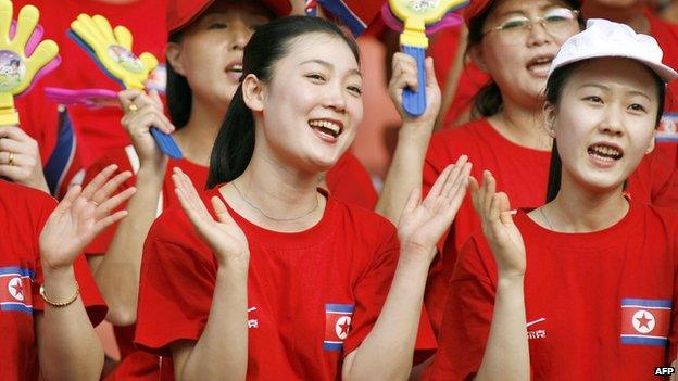 North Korean cheerleaders show their support to their team before the quarter-final match against Germany in the FIFA Women's Football World Cup in Wuhan, in China's central province of Hubei, on 22 September 2007.