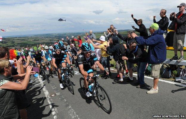 Team Sky is cheered along as stage two of the Tour de France passes over Holme Moss Moor, Yorkshire