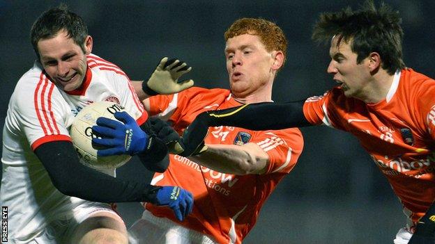 Tyrone's Ronan McNabb is challenged by Kyle Carragher and Tony Kernan of Armagh