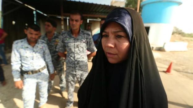 An Iraqi woman talks to the BBC team north of Baghdad - 6 July 2014