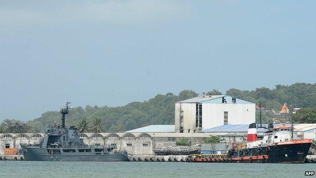 Sri Lankan naval vessel the Samudra (L) is anchored after transferring 41 would-be asylum seekers whose boat was turned away by Australia at the southern port of Galle on 7 July 2014