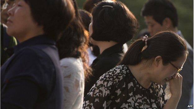 Family members of victims of the Sewol ferry disaster leave the Gwangju District Court in the southwestern South Korean city of Gwangju on 24 June 2014