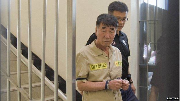 Lee Joon-seok, captain of sunken ferry Sewol, arrives at a court in Gwangju on 10 June 2014