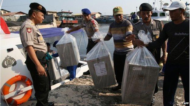 In this photograph taken on 7 July 2014, Indonesian police delivers by maritime police boat ballot boxes and polling materials to Gili Ketapang island located off East Java province ahead of the presidential election.