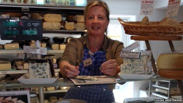 Sue Jensen in her cheese shop, "Øens Oste"