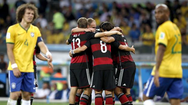 Germany players celebrate while David Luiz looks on