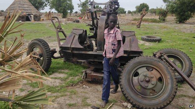 Child on anti aircraft gun