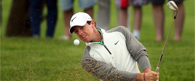 Rory McIlroy of Northern Ireland plays a shot out of a bunker on the 11th hole during the opening day of the Irish Open at the Fota Island Resort in Cork, Ireland, on June 19, 2014