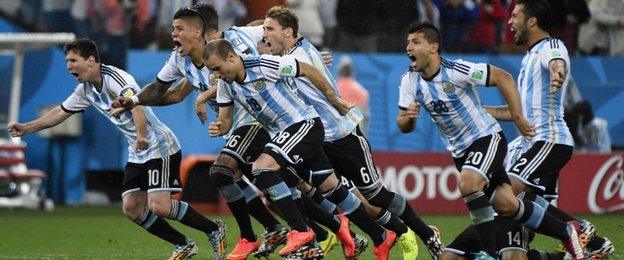 Argentina celebrate winning the penalty shootout