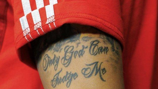 Mesut Ozil's tattoo reads "Only God can judge me"