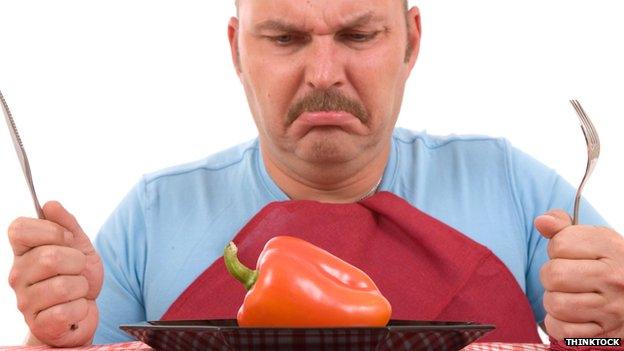 Man eating salad