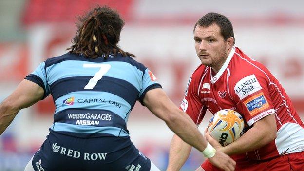 Ken Owens, of Scarlets, takes on Cardiff Blues' Josh Navidi