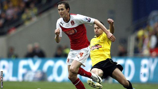 Burton Albion's Phil Edwards (R) tackles Fleetwood Town's Josh Morris