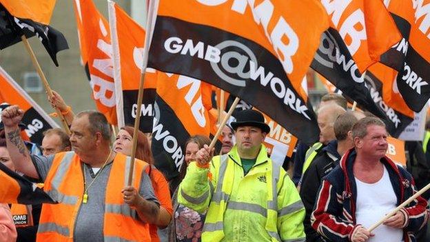 Members of the GMB union make their way through Brighton