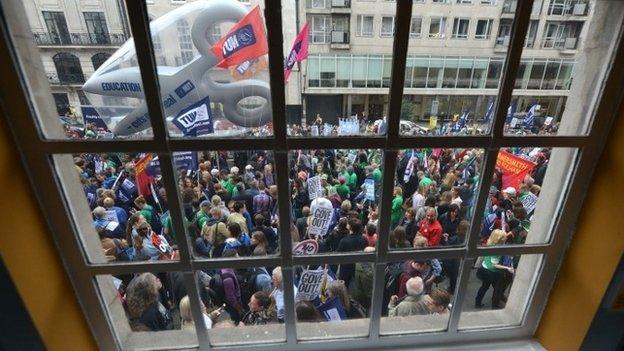 People on strike, seen through a window