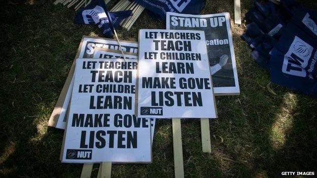 Protest placards put out by public sector workers striking against pay cuts 10/7/14