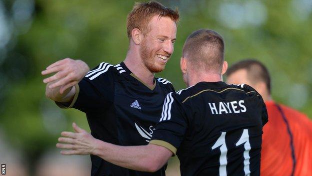 Adam Rooney scored a hat-trick as Aberdeen beat Daugava Riga 3-0