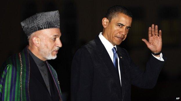 President Barack Obama meets with Afghan President Hamid Karzai, left, at the presidential palace in Kabul, Afghanistan, Sunday, March 28, 2010.
