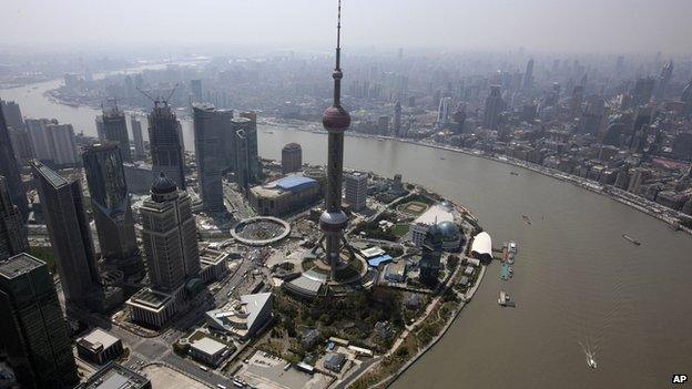 In this photo taken on 28 March, 2012, boats cruise through a river in Shanghai, China