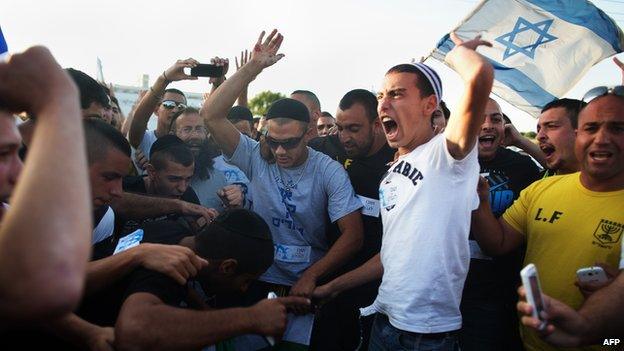 Right-wing Israelis shout slogans during an anti-Palestinian demonstration at the Gush Etzion junction, a settlement next to the biblical Palestinian town of Bethlehem on 16 June 2014