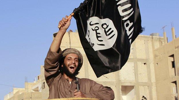 Islamist fighter on parade in the Syrian province of Raqqa, 30 June 2014