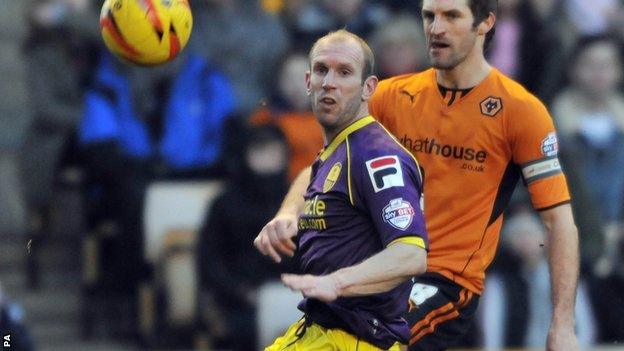 Wolverhampton Wanderers's Sam Ricketts (right) and Gareth Roberts Notts County's (left) challenge