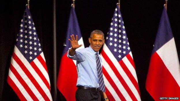 President Obama waves from the stage at a speech in Austin, Texas on 10 July