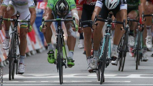 Peter Sagan (green) and Matte Trentin cross the line