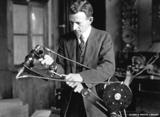 William David Coolidge holds an early portable X-ray tube