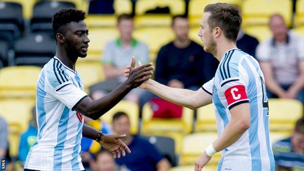 Prince Buaben (left) is congratulated by Danny Wilson in Hearts 3-0 win over East Fife.