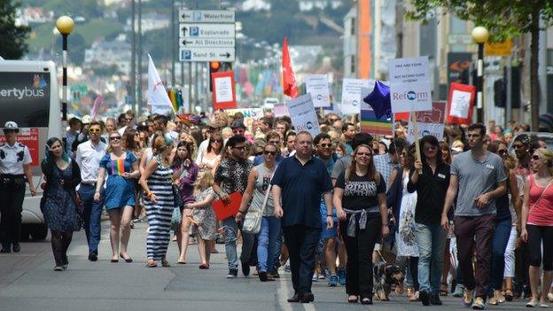 Gay rights protestors march to Liberty Square