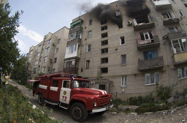 A fire engine outside a damaged block of flats in Marinka, Donetsk, 12 July