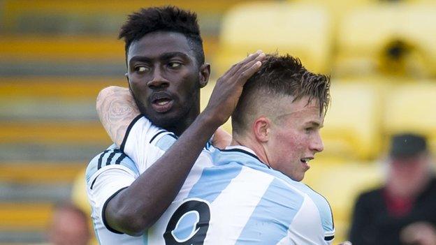 Prince Buaben (left) is congratulated by Danny Wilson in Hearts 3-0 win over East Fife.