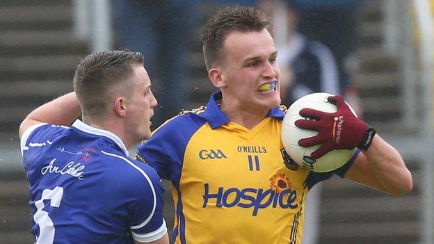 Cavan's Joshua Hayes tries to tackle Roscommon's Enda Smith