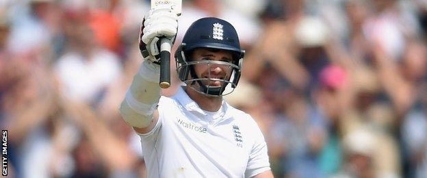 James Anderson raises his bat for the first time in competitive cricket