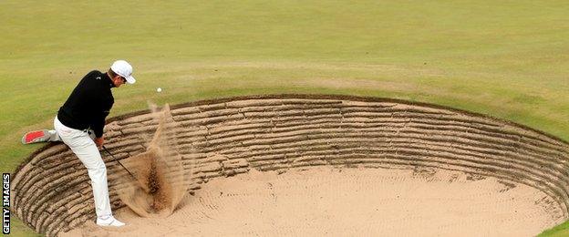 Justin Rose plays a bunker shot at the fifth hole in the Scottish Open third round