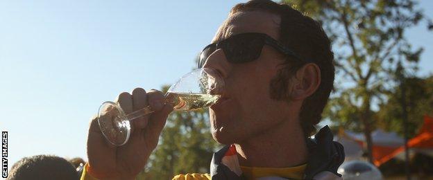 Sir Bradley Wiggins sips champagne after his 2012 triumph