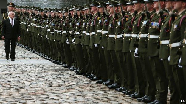 President Michael D Higgins inspects a Guard of Honour during an interfaith service of commemoration at the Royal Hospital Kilmainham.