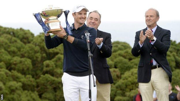 Justin Rose collects his trophy