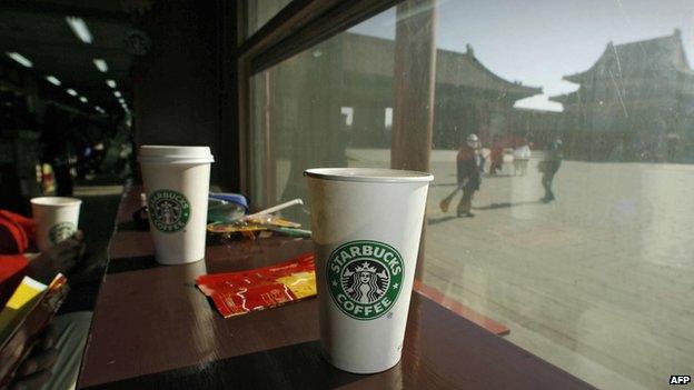 Coffee cups sit on the windowsill at the Starbucks coffee shop in Beijing's Forbidden City on 18 January 2007.