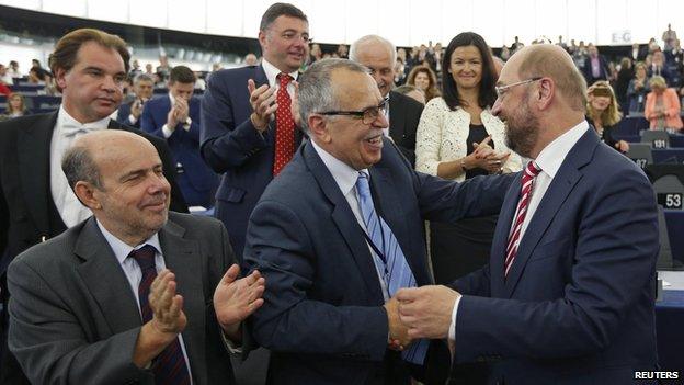 European Parliament President Martin Schulz (right) is greeted after his re-election as president, 1 Jul 14