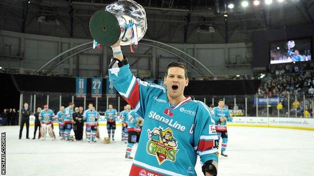 Giants captain Adam Keefe celebrates with the Elite League trophy in a fourth title success for Belfast