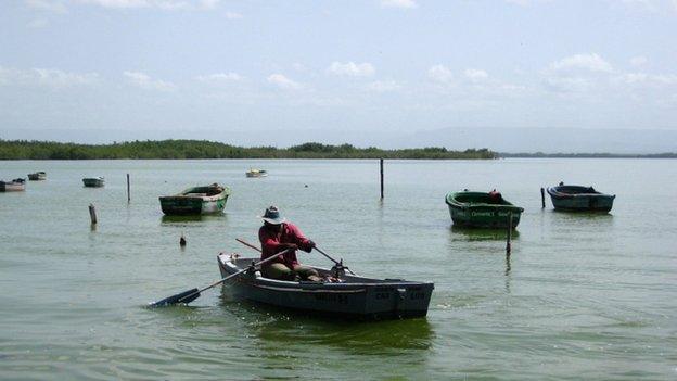 A fisherman rows his boat in Guantanamo Bay in June 2014