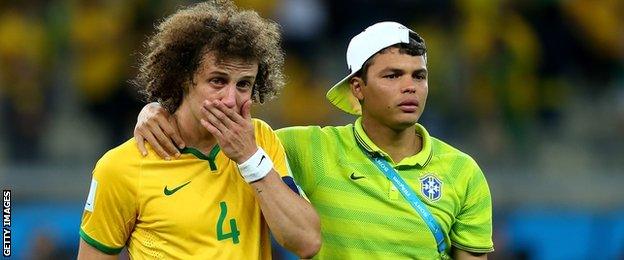 Brazil's David Luiz (L) being comforted by Thiago Silva