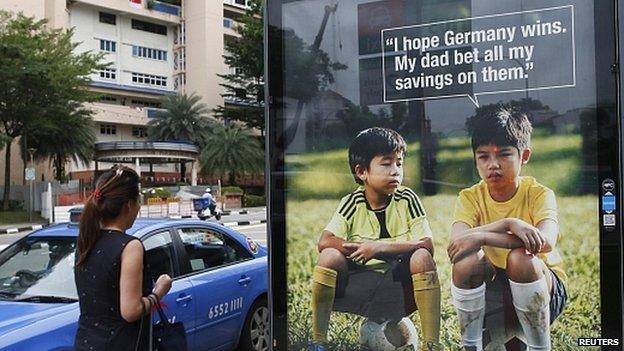 World Cup anti-gambling advertisement at taxi stand in Singapore. 9 July 2014