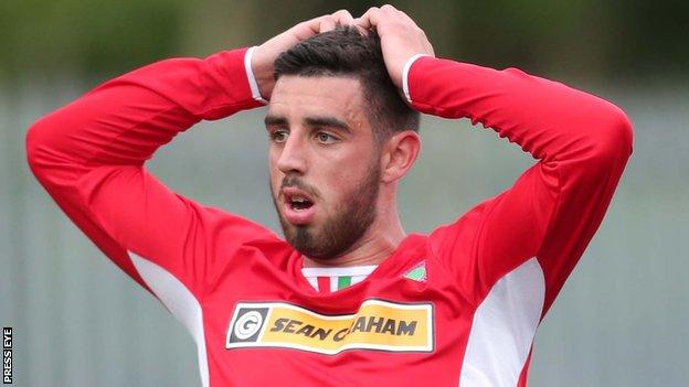 Cliftonville striker Joe Gormley shows his disappointment after missing an early chance at Solitude