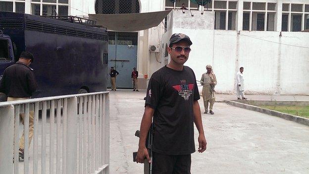 Guards outside central jail Gujranwala, where Saba’s father and uncle are incarcerated